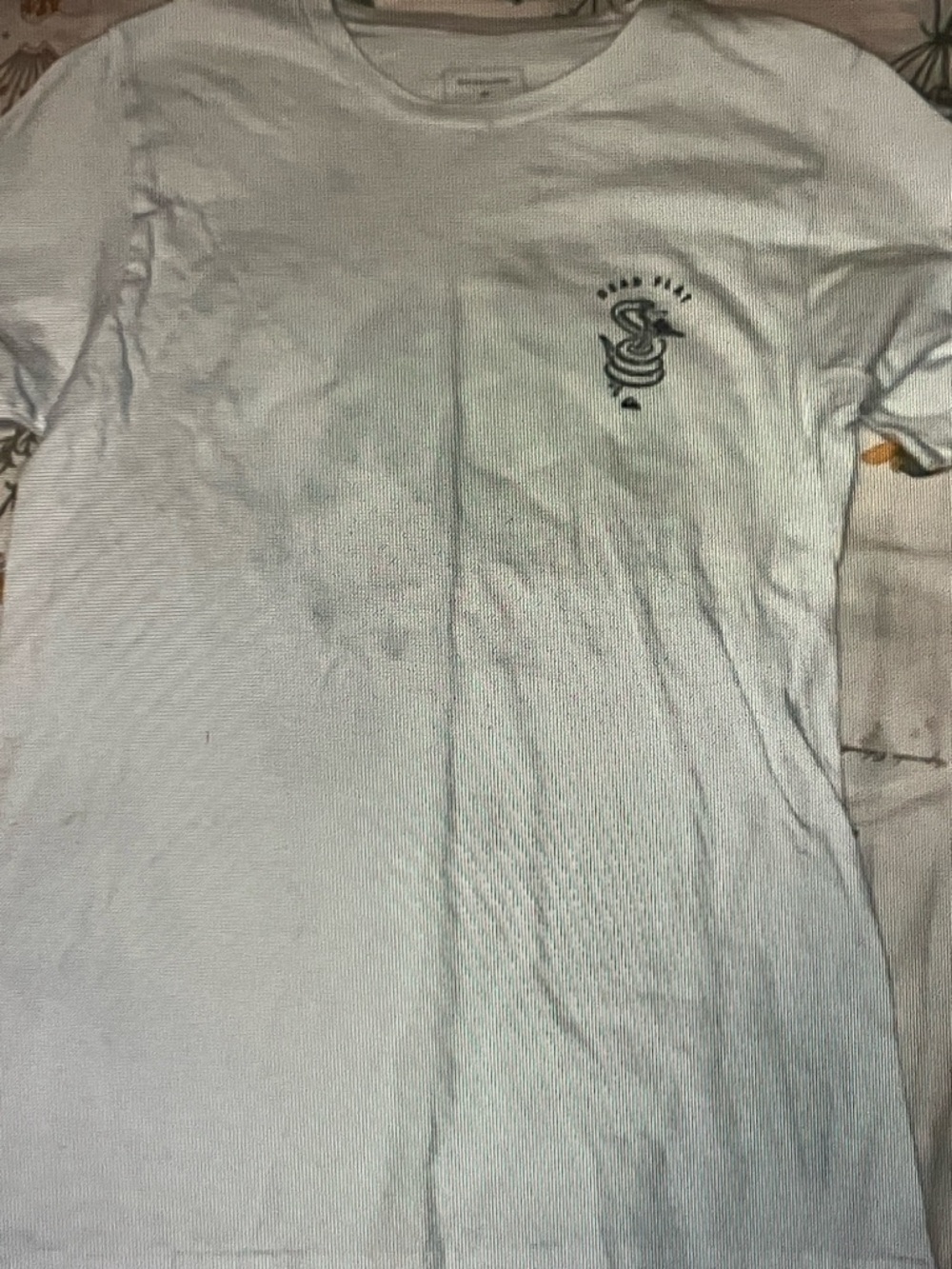 Quiksilver White Short Sleeve Tee with Small Black Snake Chest Graphic